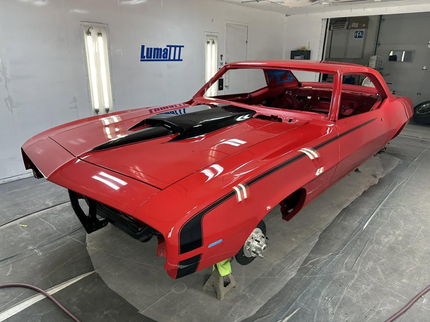 1969 Chevrolet Camaro in GM Solar Red inside the Linear paint booth