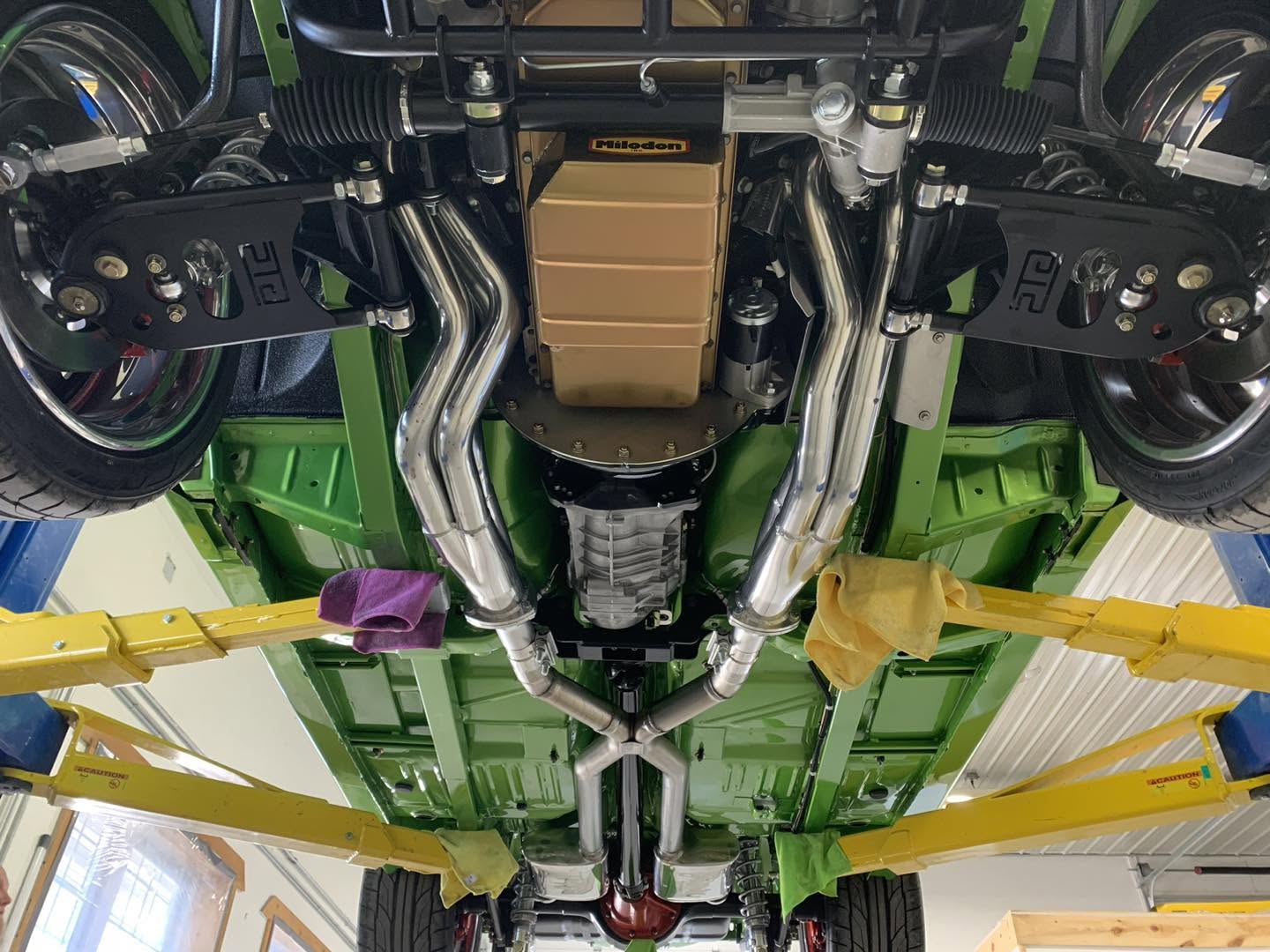 Underside of the Green With Envy Demon on a lift, floorpan painted in body color